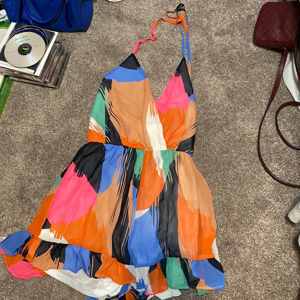 Multicolored halter romper! One snap in the front, ties at top, frilly bottom.